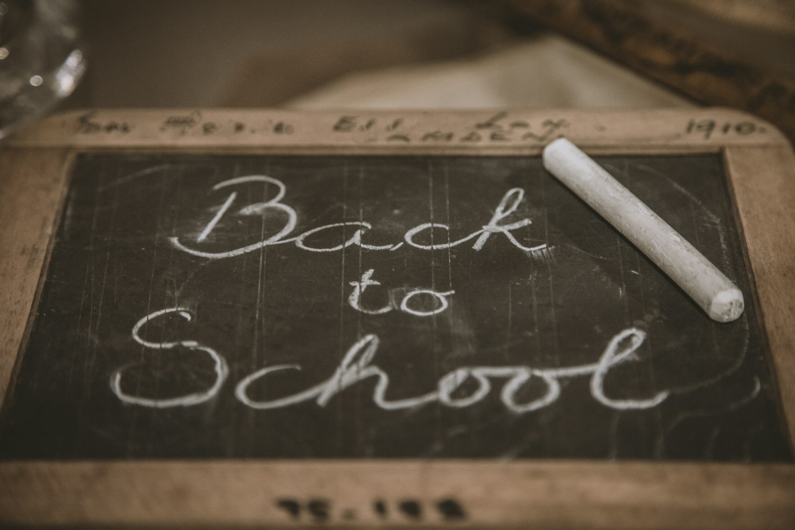 Black board with writing, Back to school and white chalk.